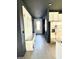 Inviting entryway with mudroom-style built-ins, coat hooks, and stylish light fixture at 4133 Gilford Cir, Ormond Beach, FL 32174