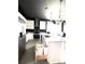 Modern kitchen featuring stainless steel appliances, white cabinets and a center island with sink at 4133 Gilford Cir, Ormond Beach, FL 32174