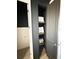Built-in linen closet with dark painted shelving, perfect for storing towels and bath essentials at 4133 Gilford Cir, Ormond Beach, FL 32174
