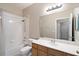 Bright bathroom with a shower and tub combination, featuring a large mirror above the vanity at 417 Victoria Hills Dr, Deland, FL 32724