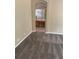 Bedroom with beige walls, gray carpet and an archway leading to the bathroom with a wooden vanity at 417 Victoria Hills Dr, Deland, FL 32724