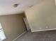 Bedroom showcasing neutral walls, gray carpet, and natural light coming from window at 417 Victoria Hills Dr, Deland, FL 32724