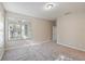 Cozy bedroom with gray carpeting, bright windows and neutral paint at 417 Victoria Hills Dr, Deland, FL 32724