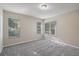 Light-filled bedroom with neutral walls, carpet, and multiple windows at 417 Victoria Hills Dr, Deland, FL 32724
