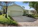 Lovely one-story home showcasing a two-car garage, brick driveway, and manicured front yard at 417 Victoria Hills Dr, Deland, FL 32724