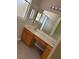 Main bathroom includes double sinks, wood cabinets, tile floor, and a shower at 417 Victoria Hills Dr, Deland, FL 32724