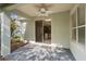 Covered patio with ceiling fan overlooking a lush, private yard at 417 Victoria Hills Dr, Deland, FL 32724