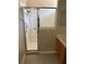 Walk-in shower with glass door, a grab bar, and updated fixtures at 417 Victoria Hills Dr, Deland, FL 32724