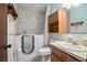 Bathroom featuring a walk-in bathtub, tile walls, vanity, and storage at 441 E Kicklighter Rd, Lake Helen, FL 32744