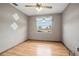Bedroom featuring hardwood floors, ceiling fan, and a window providing natural light at 441 E Kicklighter Rd, Lake Helen, FL 32744