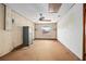 Bonus room with wood paneling, a ceiling fan, and a secure safe at 441 E Kicklighter Rd, Lake Helen, FL 32744