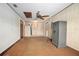Bonus room featuring wood paneling, a ceiling fan, and a secure safe at 441 E Kicklighter Rd, Lake Helen, FL 32744