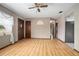 Inviting living room featuring wood laminate flooring and plenty of natural light at 441 E Kicklighter Rd, Lake Helen, FL 32744