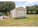 View of the detached shed, offering additional storage for tools and lawn equipment at 441 E Kicklighter Rd, Lake Helen, FL 32744