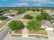 Aerial view of a single Gathering home nestled within a well-maintained, green and lush neighborhood at 486 Sycamore Springs St, Debary, FL 32713