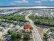 An aerial view highlights a home's location, with easy access to waterfront, community, and road networks at 486 Sycamore Springs St, Debary, FL 32713