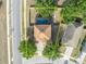 Aerial view of home, showcasing the screened-in pool, fenced yard, and neighborhood at 486 Sycamore Springs St, Debary, FL 32713