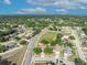 An aerial view showcases the neighborhood, filled with lush greenery and single-Gathering homes at 486 Sycamore Springs St, Debary, FL 32713