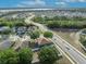 Picturesque aerial view of neighborhood near the waterfront, with lush greenery, and well-maintained roads at 486 Sycamore Springs St, Debary, FL 32713