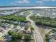 Breathtaking aerial view of waterfront community surrounded by trees, offering serene living with natural beauty at 486 Sycamore Springs St, Debary, FL 32713