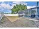 Expansive backyard with screened-in pool, lush lawn, and privacy fence, great for outdoor enjoyment at 486 Sycamore Springs St, Debary, FL 32713