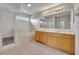 Bright bathroom featuring a double vanity, soaker tub, and a separate shower at 486 Sycamore Springs St, Debary, FL 32713