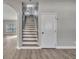 Hallway shot with wood stairs and gray walls at 486 Sycamore Springs St, Debary, FL 32713