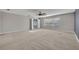 Spacious living room with neutral carpet and a large window for ample natural light at 486 Sycamore Springs St, Debary, FL 32713