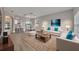 Bright living room featuring contemporary furniture, light wood floors, and an open floor plan at 486 Sycamore Springs St, Debary, FL 32713