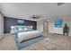 Spacious main bedroom with large bed, ensuite bathroom, and accent wall at 486 Sycamore Springs St, Debary, FL 32713