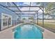 Refreshing screened-in pool with seating area, ideal for enjoying sunny days and outdoor gatherings at 486 Sycamore Springs St, Debary, FL 32713