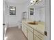 Bright bathroom featuring a single vanity, toilet, and shower-tub combo for a functional and clean space at 5265 Myakka Rd, De Leon Springs, FL 32130