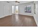 Bedroom with laminate flooring, natural light, and access to a bathroom at 5265 Myakka Rd, De Leon Springs, FL 32130