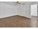 Bedroom with laminate flooring, natural light, and access to a closet at 5265 Myakka Rd, De Leon Springs, FL 32130