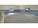 Bright bonus room boasts a carpeted floor, base trim and natural light from two windows at 5265 Myakka Rd, De Leon Springs, FL 32130