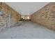 Brick garage with ample open space and a covered area, ideal for parking or storage at 5265 Myakka Rd, De Leon Springs, FL 32130