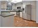 Bright kitchen featuring stainless steel appliances and tile flooring at 5265 Myakka Rd, De Leon Springs, FL 32130