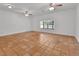 Spacious living room featuring tile flooring and a large window at 5265 Myakka Rd, De Leon Springs, FL 32130
