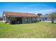Expansive backyard with a screened lanai, ideal for outdoor relaxation and activities at 5519 Silent Brook Dr, Orlando, FL 32821