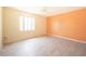 Cozy bedroom with tile floors and a window providing natural light at 5519 Silent Brook Dr, Orlando, FL 32821