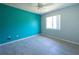 Bright bedroom features tile floors, modern fan, and natural light from the window at 5519 Silent Brook Dr, Orlando, FL 32821