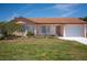 Charming single-story home with a well-maintained lawn and lovely front garden at 5519 Silent Brook Dr, Orlando, FL 32821