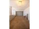 Spacious garage featuring a roll-up door and plenty of room for storage or projects at 5519 Silent Brook Dr, Orlando, FL 32821