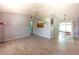 Open living room boasts neutral tile floors and a view of the kitchen and dining area at 5519 Silent Brook Dr, Orlando, FL 32821