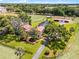 An aerial view of the property showcasing the house, pool, barn, and surrounding acreage at 5549 Aragon Ave, De Leon Springs, FL 32130