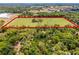 Aerial shot showcasing vast land parcel perfect for building a dream home or development, offering plenty of space at 5549 Aragon Ave, De Leon Springs, FL 32130