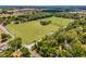 Expansive horse farm with lush green pastures and mature trees, showcasing its rural charm at 5549 Aragon Ave, De Leon Springs, FL 32130
