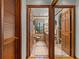 Bathroom with wood trim featuring a mirror, a window, and a chair at 5549 Aragon Ave, De Leon Springs, FL 32130