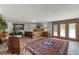 Spacious bedroom featuring a large bed, wooden accents, and an ornate rug on the tile floor at 5549 Aragon Ave, De Leon Springs, FL 32130