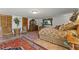 Inviting bedroom showcasing warm neutral colors and wooden furnishings on a tile floor at 5549 Aragon Ave, De Leon Springs, FL 32130